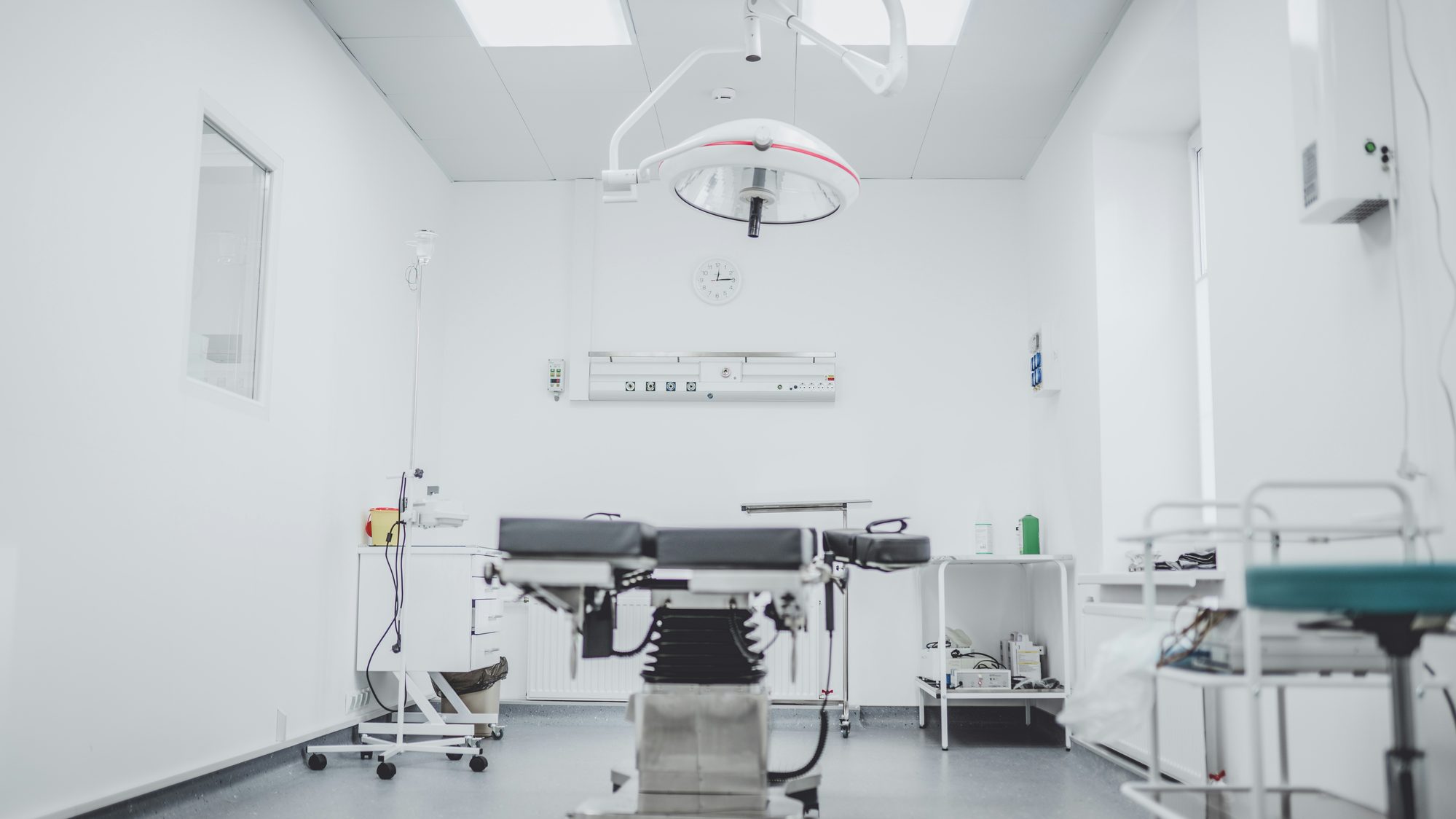 Modern clinical treatment room with medical equipment